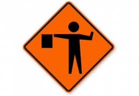 Work Zone Flagger directing traffic for safety compliance in construction.